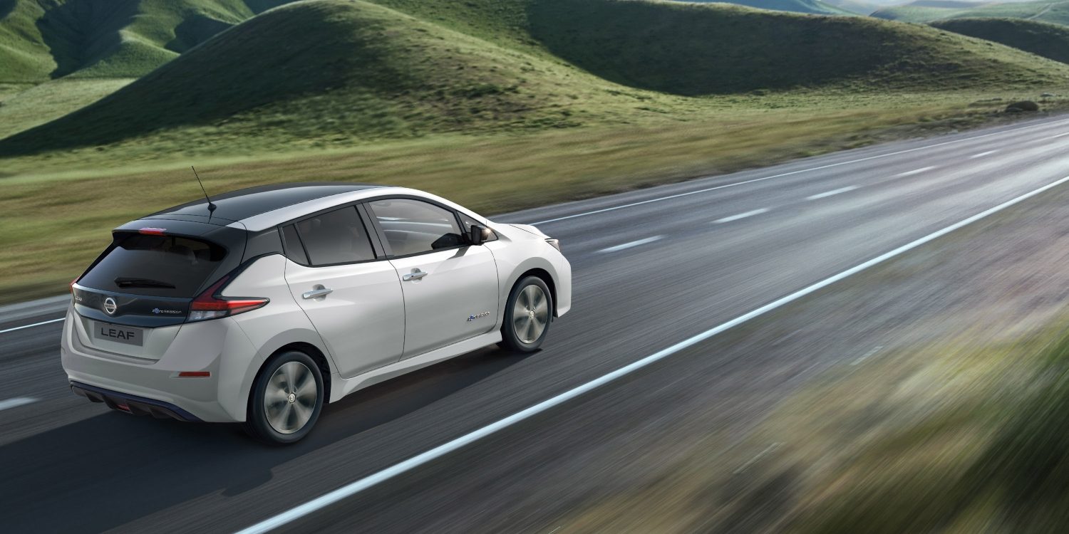 Nissan LEAF shown from the rear driving on a highway