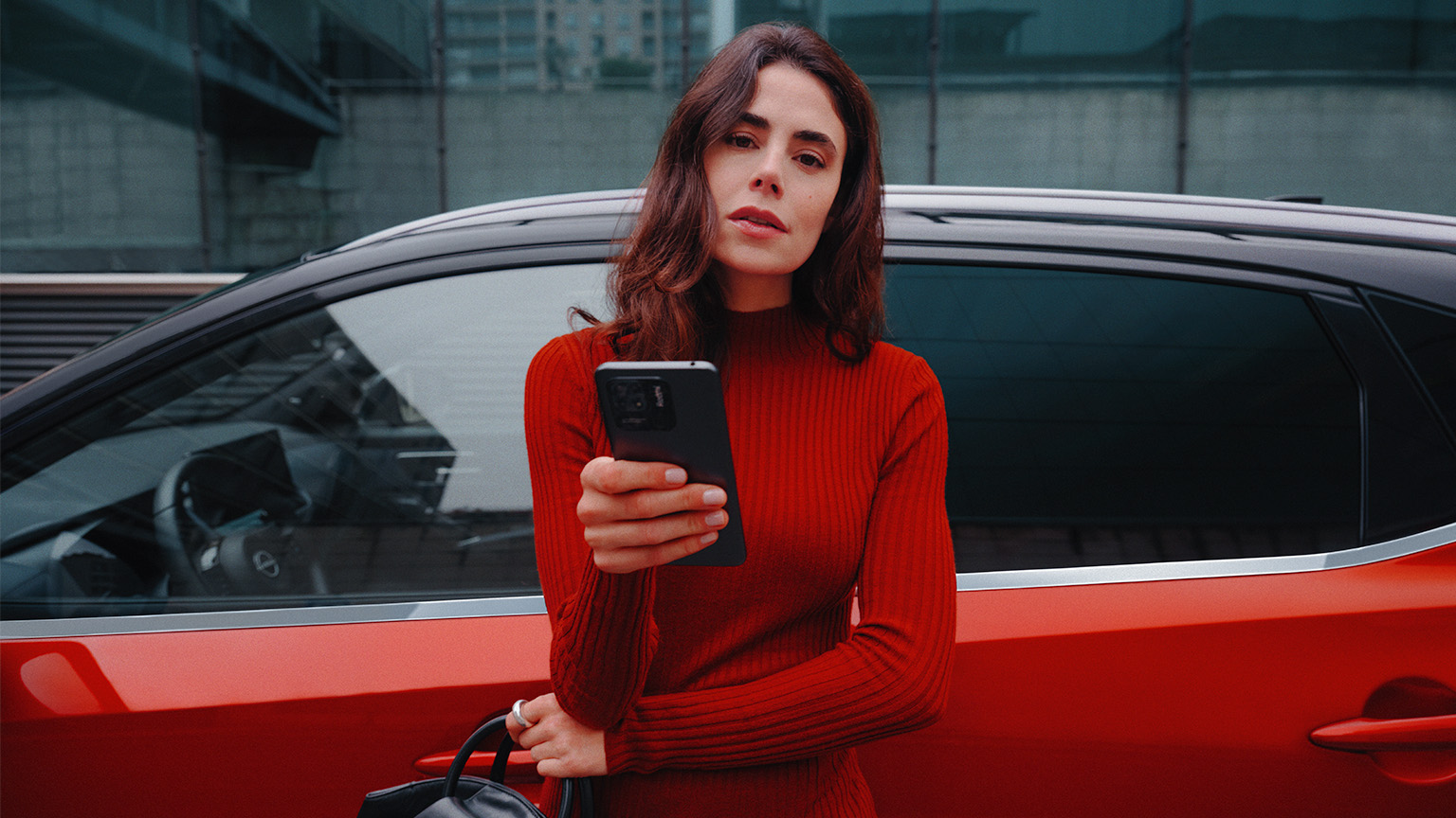 Nissan Qashqai e-Power close up side view with woman holding phone