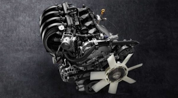 2021 Nissan Frontier showing 2.5 liter petrol engine on black background