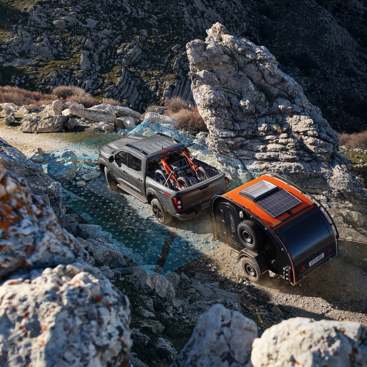 2021 Nissan Frontier showing intelligent around view monitor sensors off road with trailer