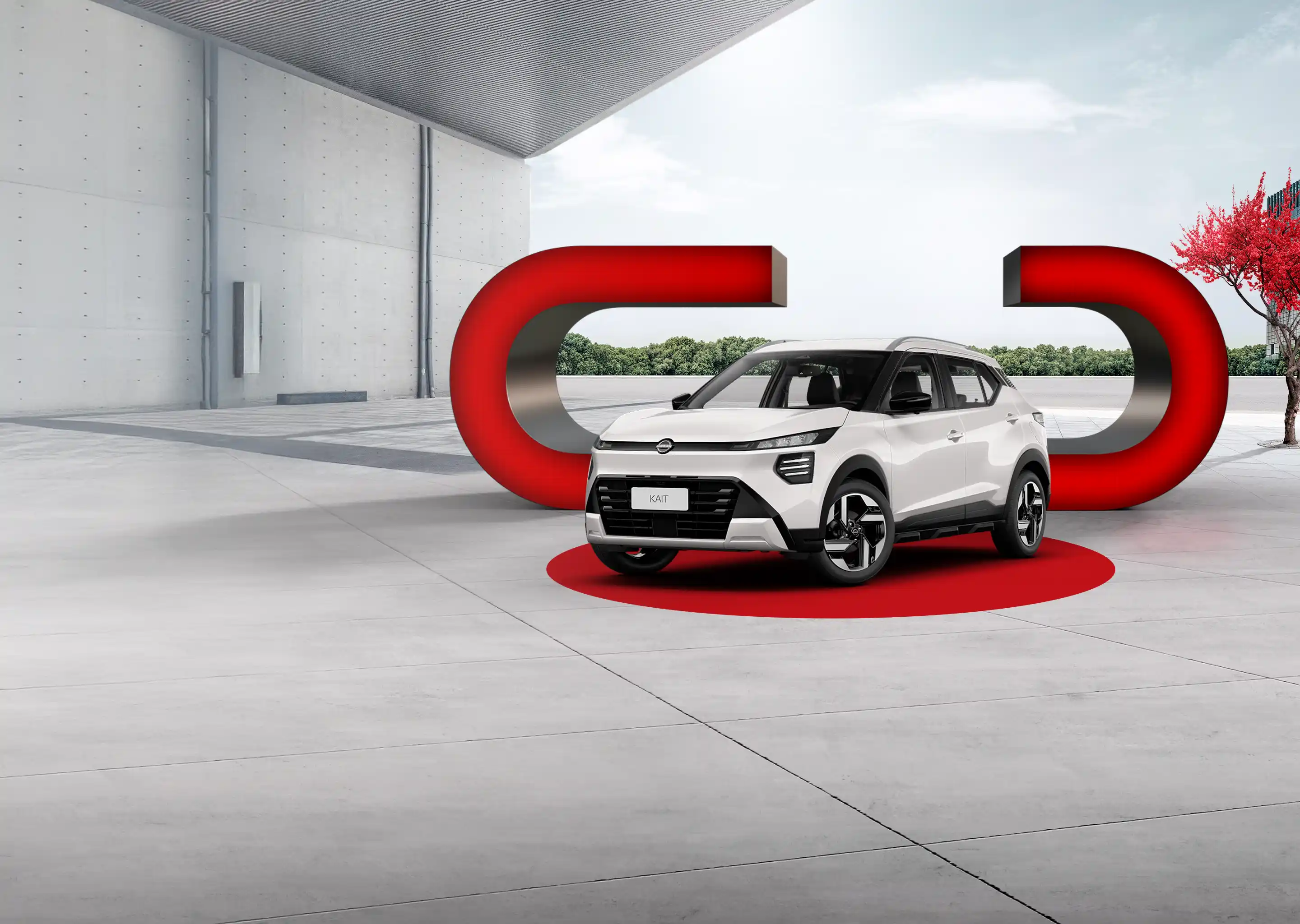 Caminhonete prata em um cenário moderno, com um fundo de montanhas e uma árvore vermelha.