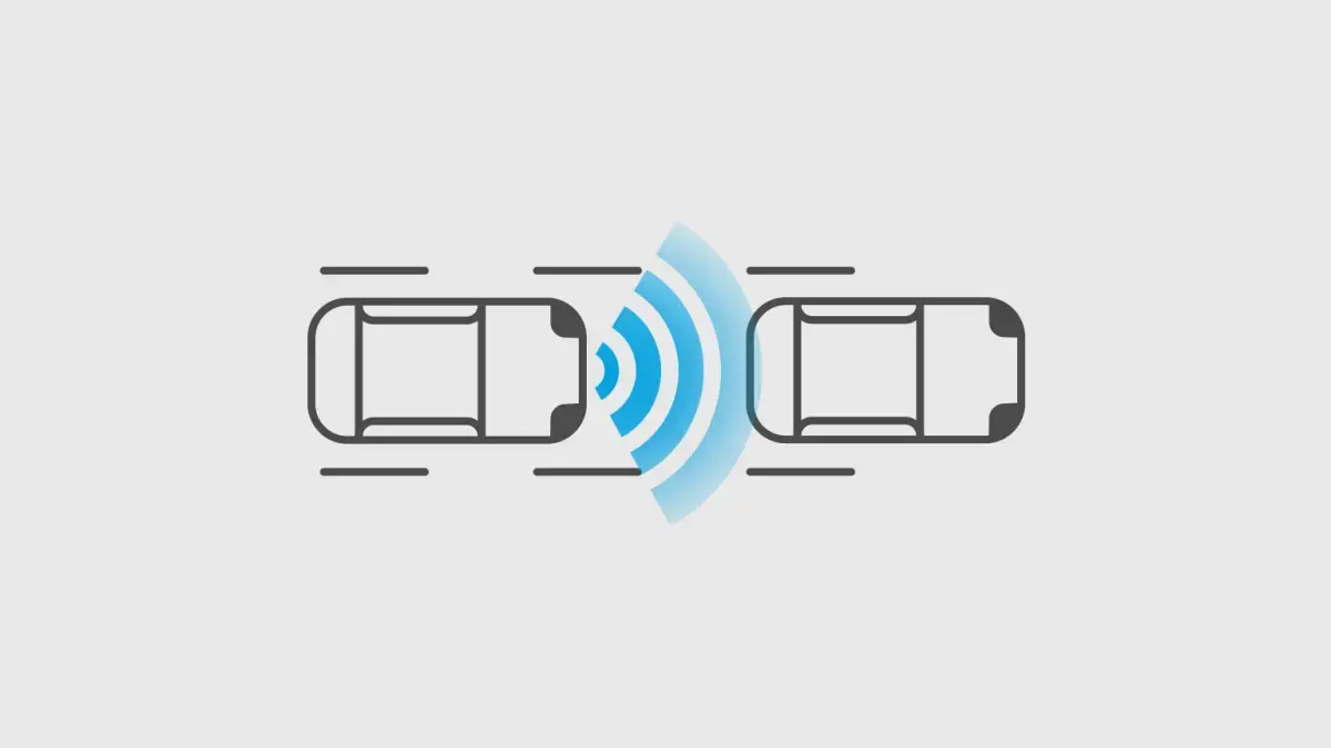 Diagrama: Dois carros em movimento. Ondas azuis entre eles representam o sistema de alerta de colisão frontal.