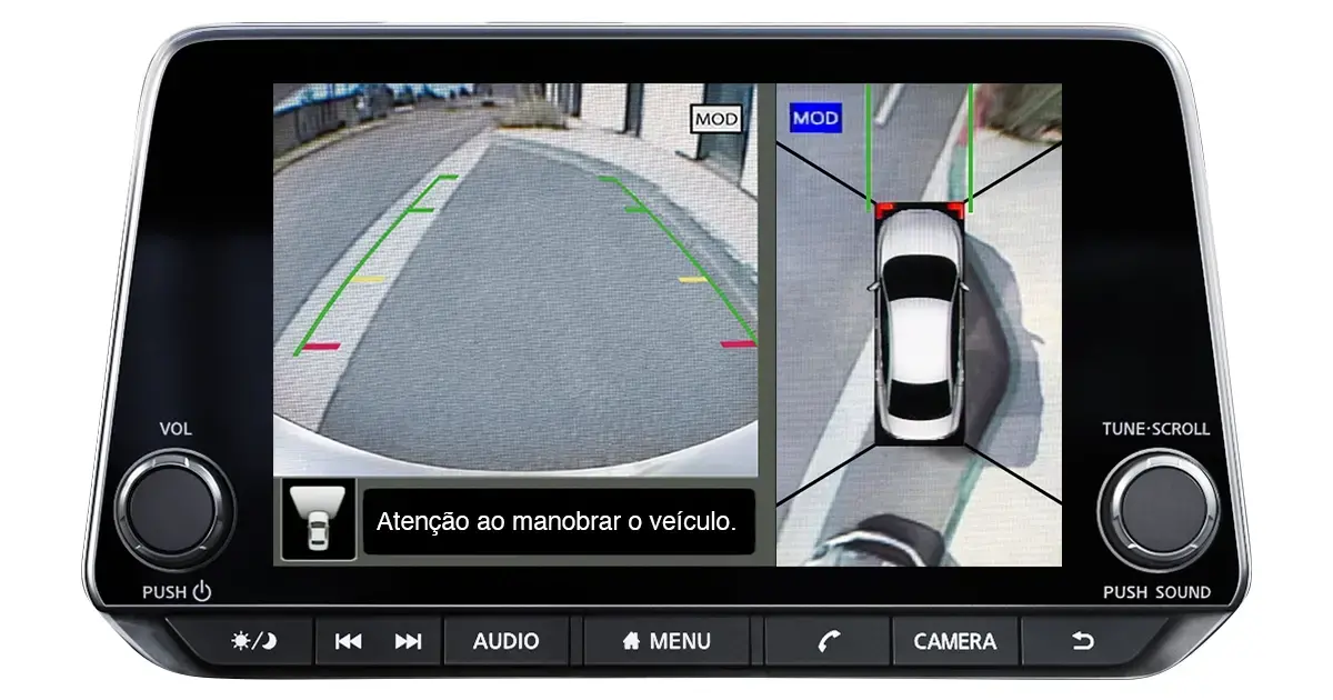 Homem dirigindo um carro moderno, com interior sofisticado e vista de uma cidade com árvores vermelhas ao fundo.