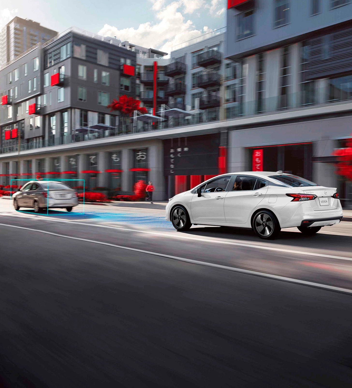Carros Nissan em uma rua urbana, destacando um veículo à frente com tecnologia avançada e um segundo carro ao fundo. Cenário urbano contemporâneo.