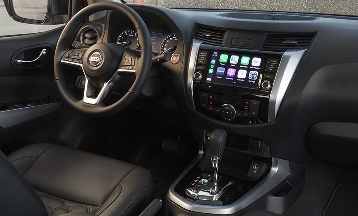 2021 Nissan Frontier driving on a mountain road