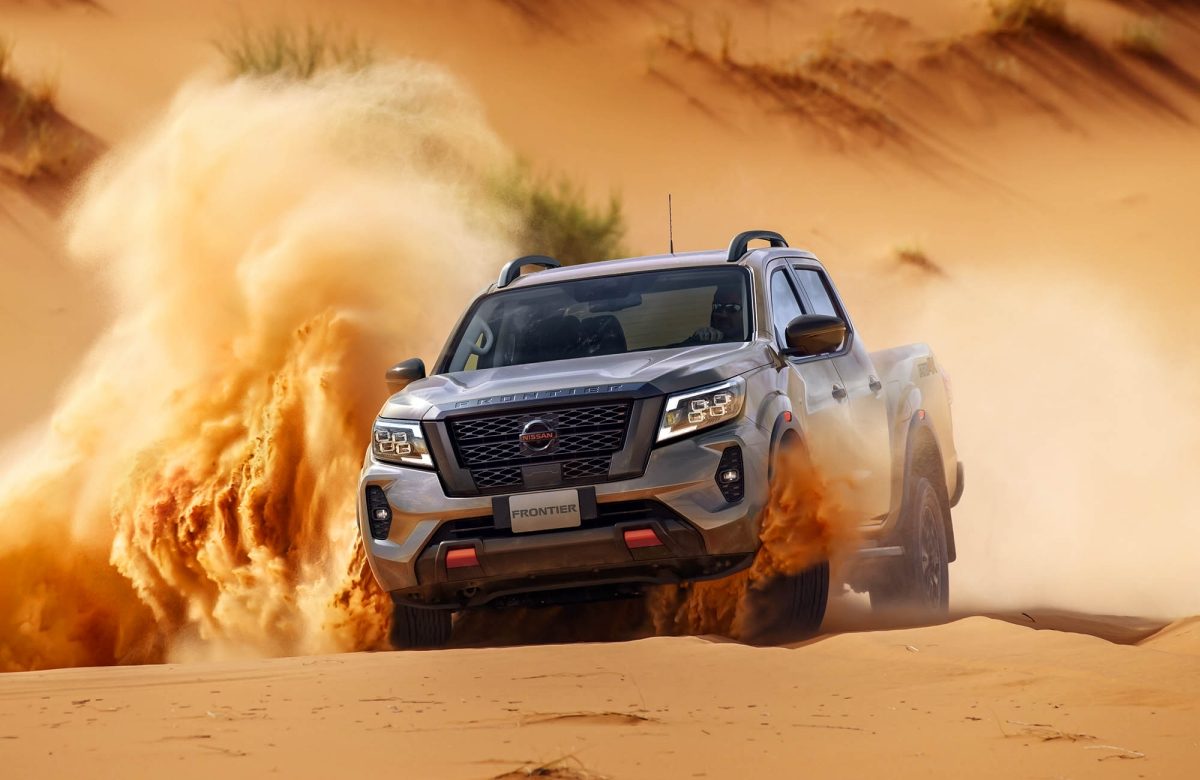 2021 Nissan Frontier PRO-4X climbing over rugged rock pile