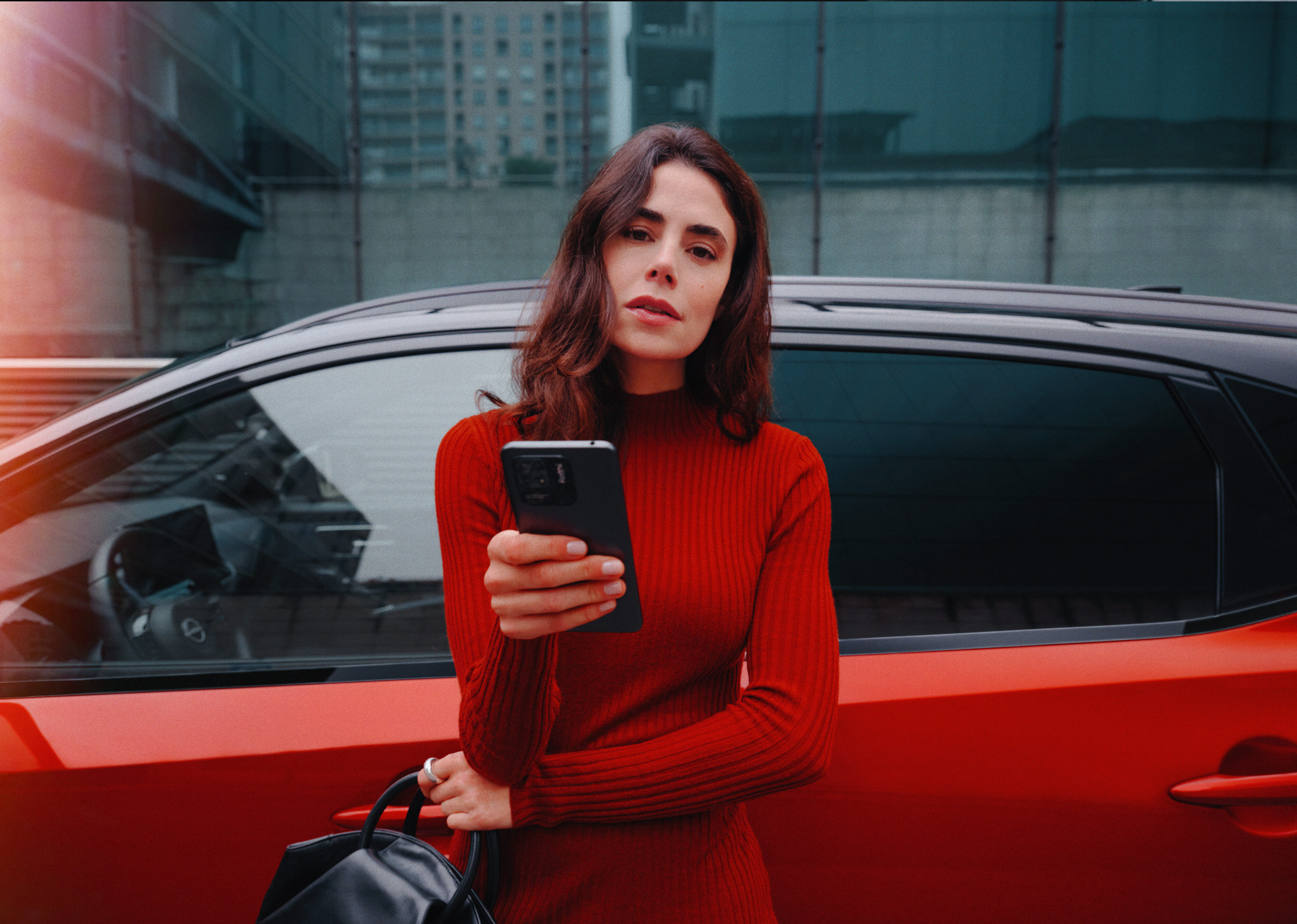 Nissan Qashqai e-Power close up side view with woman holding phone